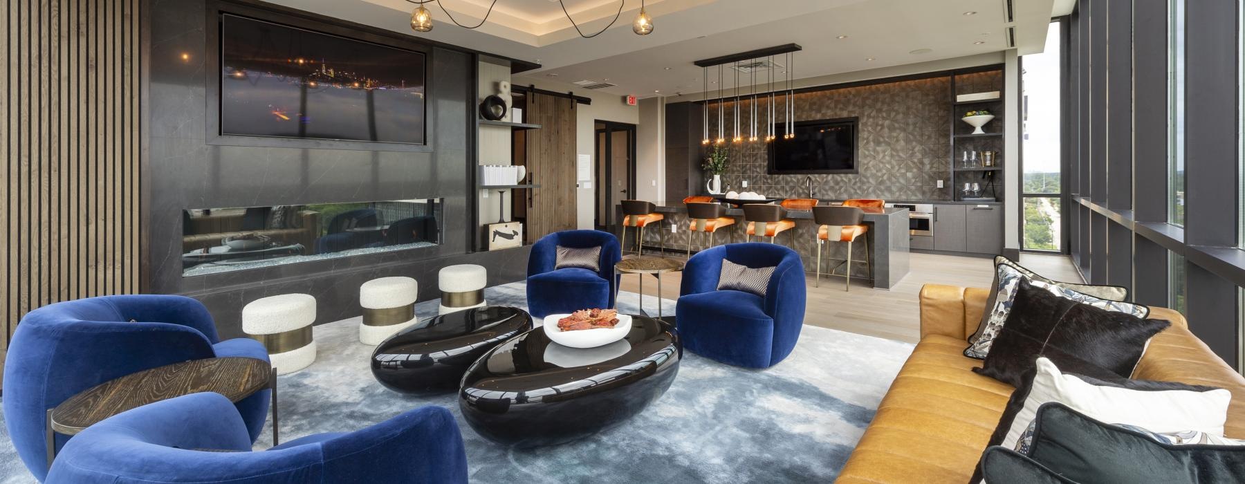 a room with a couch and chairs