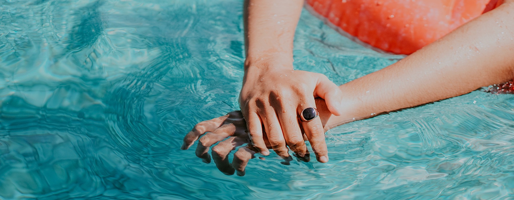 hands in a pool