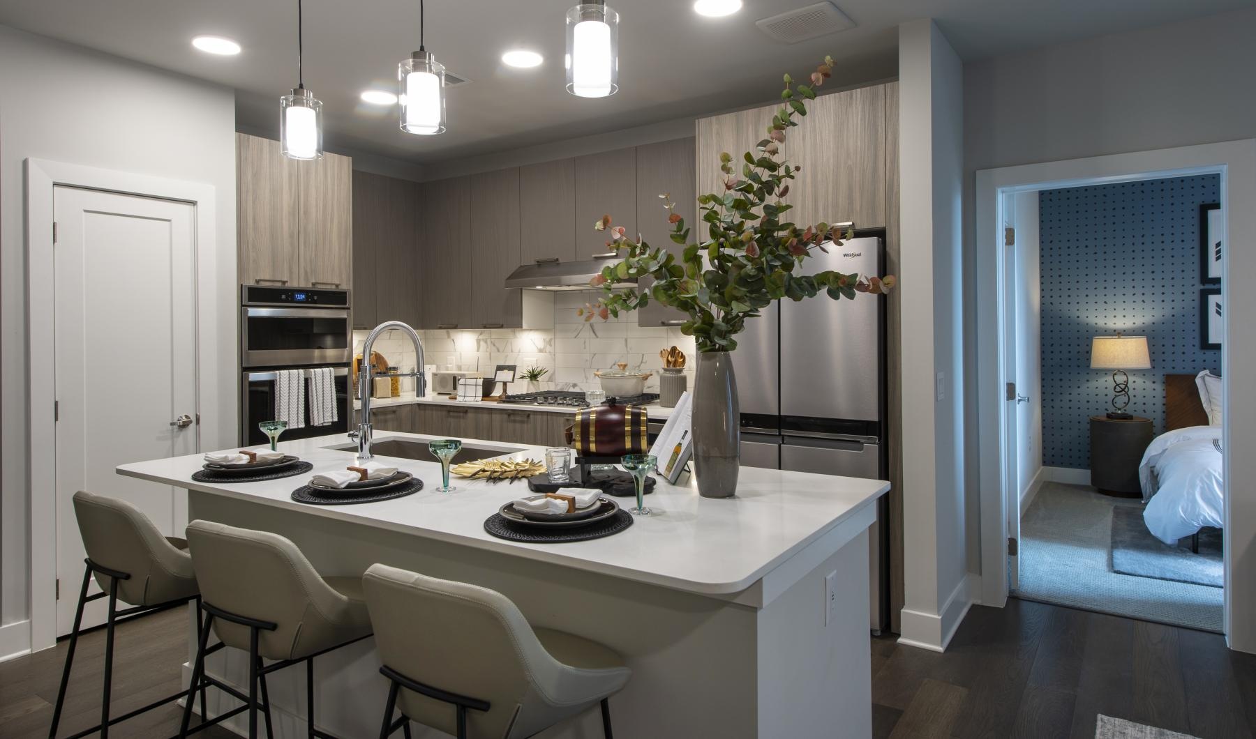 a kitchen with a table and chairs
