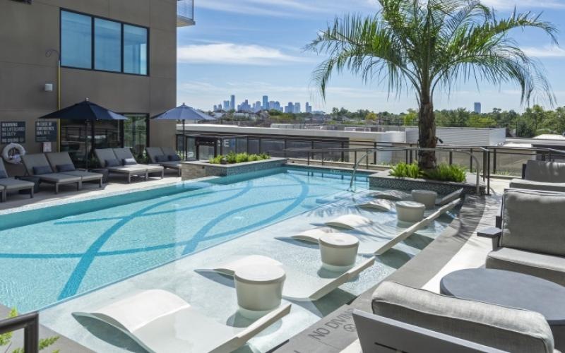 a pool with chairs around it